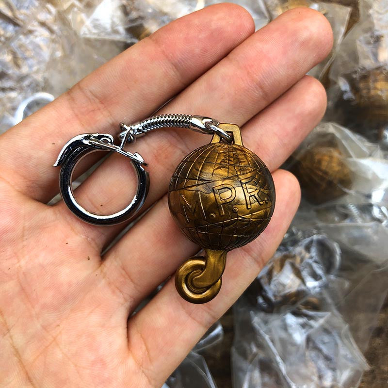 porte clefs ancien mpr globe transport roue train locomotive publicitaire vintage