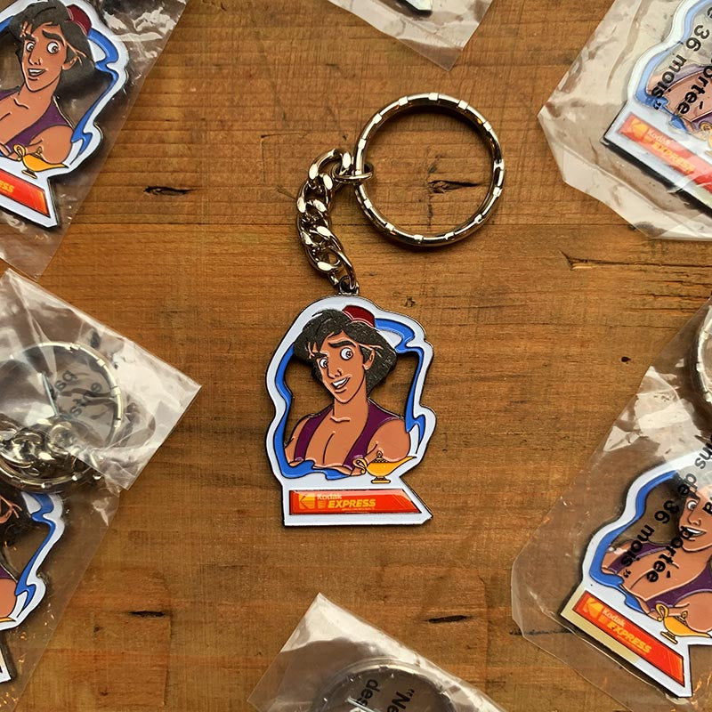 porte clef clefs kodak disney partenaire publicitaire 1992 sortie du film aladdin kodak express